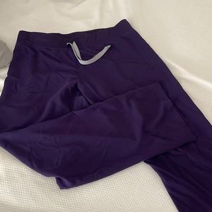 Purple scrub pants. Figs.